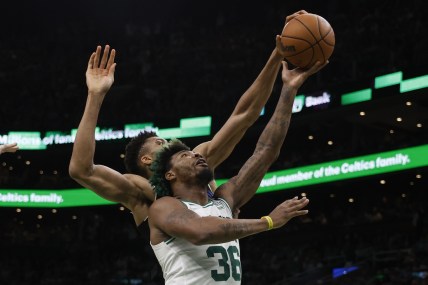 May 15, 2022; Boston, Massachusetts, USA; Milwaukee Bucks forward Giannis Antetokounmpo (34) comes from behind to block a shot by Boston Celtics guard Marcus Smart (36) during the second quarter of game seven of the second round of the 2022 NBA playoffs at TD Garden. Mandatory Credit: Winslow Townson-USA TODAY Sports