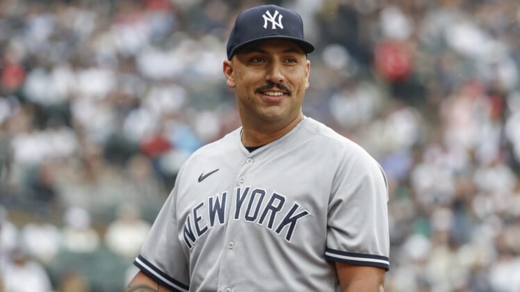 May 15, 2022; Chicago, Illinois, USA; New York Yankees starting pitcher Nestor Cortes (65) smiles as he returns to dugout after pitching against the Chicago White Sox during the eight inning at Guaranteed Rate Field. Mandatory Credit: Kamil Krzaczynski-USA TODAY Sports