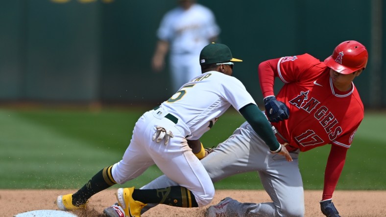 May 15, 2022; Oakland, California, USA; Oakland Athletics second baseman Tony Kemp (5) tags out Los Angeles Angels designated hitter Shohei Ohtani (17) at second base during the fifth inning at RingCentral Coliseum. Mandatory Credit: Robert Edwards-USA TODAY Sports