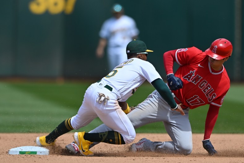 May 15, 2022; Oakland, California, USA; Oakland Athletics second baseman Tony Kemp (5) tags out Los Angeles Angels designated hitter Shohei Ohtani (17) at second base during the fifth inning at RingCentral Coliseum. Mandatory Credit: Robert Edwards-USA TODAY Sports