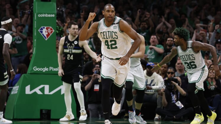 May 15, 2022; Boston, Massachusetts, USA; Boston Celtics center Al Horford (42) pumps his fist as he heads back up court after hitting a basket against the Milwaukee Bucks during the second half of game seven of the second round of the 2022 NBA playoffs at TD Garden. Mandatory Credit: Winslow Townson-USA TODAY Sports