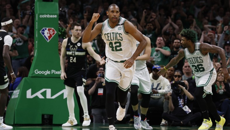 May 15, 2022; Boston, Massachusetts, USA; Boston Celtics center Al Horford (42) pumps his fist as he heads back up court after hitting a basket against the Milwaukee Bucks during the second half of game seven of the second round of the 2022 NBA playoffs at TD Garden. Mandatory Credit: Winslow Townson-USA TODAY Sports