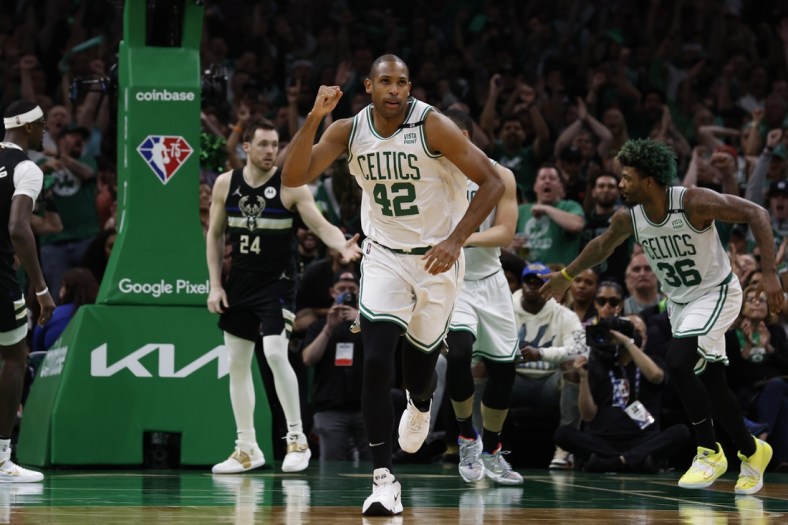 May 15, 2022; Boston, Massachusetts, USA; Boston Celtics center Al Horford (42) pumps his fist as he heads back up court after hitting a basket against the Milwaukee Bucks during the second half of game seven of the second round of the 2022 NBA playoffs at TD Garden. Mandatory Credit: Winslow Townson-USA TODAY Sports