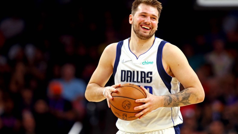 May 15, 2022; Phoenix, Arizona, USA; Dallas Mavericks guard Luka Doncic (77) reacts during the fourth quarter against the Phoenix Suns in game seven of the second round for the 2022 NBA playoffs at Footprint Center. Mandatory Credit: Mark J. Rebilas-USA TODAY Sports