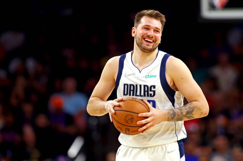 May 15, 2022; Phoenix, Arizona, USA; Dallas Mavericks guard Luka Doncic (77) reacts during the fourth quarter against the Phoenix Suns in game seven of the second round for the 2022 NBA playoffs at Footprint Center. Mandatory Credit: Mark J. Rebilas-USA TODAY Sports