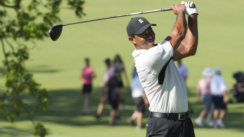 May 16, 2022; Tulsa, Oklahoma, USA; Tiger Woods hits his tee shot on the 13th hole during a practice round for the PGA Championship golf tournament at Southern Hills Country Club. Mandatory Credit: Michael Madrid-USA TODAY Sports