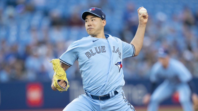 May 16, 2022; Toronto, Ontario, CAN; Toronto Blue Jays starting pitcher Yusei Kikuchi (16) throws a pitch against the Seattle Mariners during the first inning at Rogers Centre. Mandatory Credit: Nick Turchiaro-USA TODAY Sports