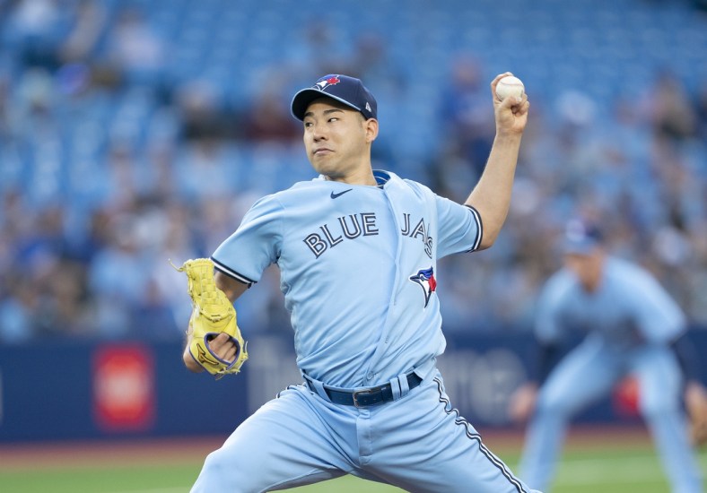 May 16, 2022; Toronto, Ontario, CAN; Toronto Blue Jays starting pitcher Yusei Kikuchi (16) throws a pitch against the Seattle Mariners during the first inning at Rogers Centre. Mandatory Credit: Nick Turchiaro-USA TODAY Sports