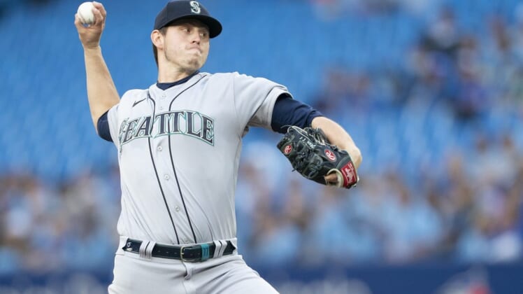 May 16, 2022; Toronto, Ontario, CAN; Seattle Mariners starting pitcher Chris Flexen (77) throws a pitch against the Toronto Blue Jays during the first inning at Rogers Centre. Mandatory Credit: Nick Turchiaro-USA TODAY Sports