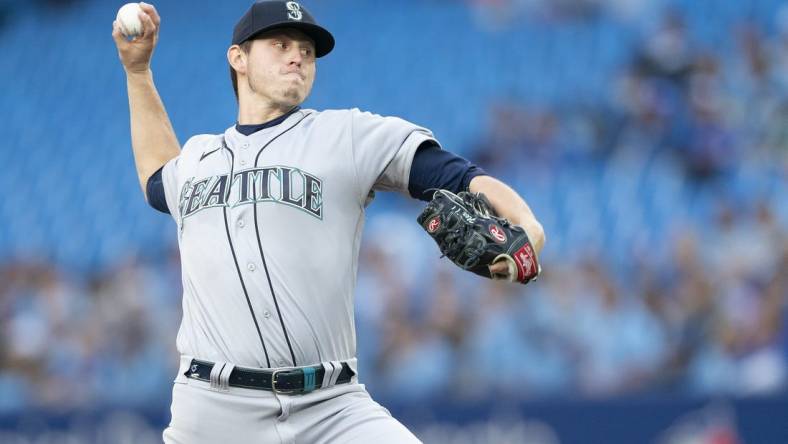 May 16, 2022; Toronto, Ontario, CAN; Seattle Mariners starting pitcher Chris Flexen (77) throws a pitch against the Toronto Blue Jays during the first inning at Rogers Centre. Mandatory Credit: Nick Turchiaro-USA TODAY Sports