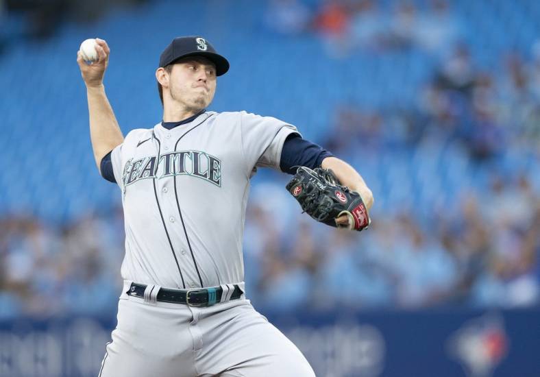 May 16, 2022; Toronto, Ontario, CAN; Seattle Mariners starting pitcher Chris Flexen (77) throws a pitch against the Toronto Blue Jays during the first inning at Rogers Centre. Mandatory Credit: Nick Turchiaro-USA TODAY Sports