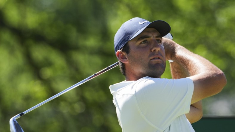 May 16, 2022; Tulsa, Oklahoma, USA; Scottie Scheffler hits his tee shot 14 during a practice round for the PGA Championship golf tournament at Southern Hills Country Club. Mandatory Credit: Michael Madrid-USA TODAY Sports