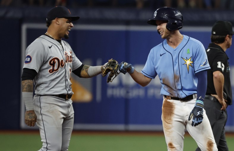 May 16, 2022; St. Petersburg, Florida, USA; Tampa Bay Rays right fielder Brett Phillips (35) and Detroit Tigers shortstop Javier Baez (28) smile with each other during the third inning at Tropicana Field. Mandatory Credit: Kim Klement-USA TODAY Sports