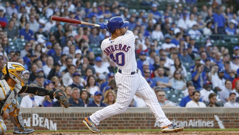 May 16, 2022; Chicago, Illinois, USA; Chicago Cubs catcher Willson Contreras (40) hits a grand slam off of Pittsburgh Pirates relief pitcher Bryse Wilson during the first inning at Wrigley Field. Mandatory Credit: Kamil Krzaczynski-USA TODAY Sports