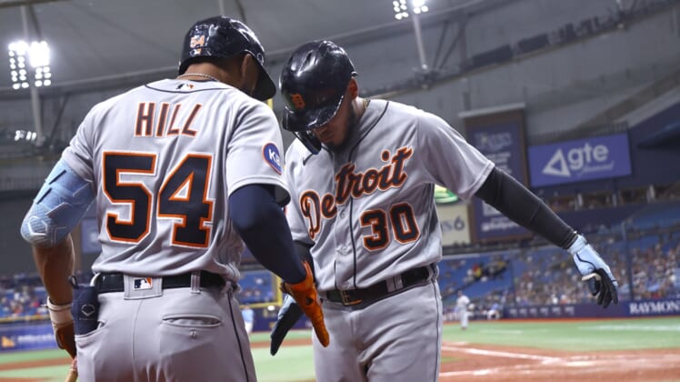 May 16, 2022; St. Petersburg, Florida, USA; Detroit Tigers shortstop Harold Castro (30) is congratulated by Detroit Tigers center fielder Derek Hill (54) as he scores run during the ninth inning against the Tampa Bay Rays at Tropicana Field. Mandatory Credit: Kim Klement-USA TODAY Sports