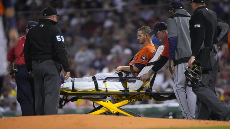 May 16, 2022; Boston, Massachusetts, USA; Houston Astros pitcher Jake Odorizzi (17) is carted off on a stretcher after suffering a leg injury during the fifth inning against the Boston Red Sox at Fenway Park. Mandatory Credit: Gregory Fisher-USA TODAY Sports