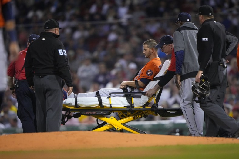 May 16, 2022; Boston, Massachusetts, USA; Houston Astros pitcher Jake Odorizzi (17) is carted off on a stretcher after suffering a leg injury during the fifth inning against the Boston Red Sox at Fenway Park. Mandatory Credit: Gregory Fisher-USA TODAY Sports