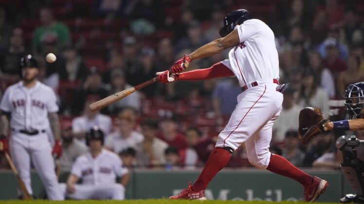 May 16, 2022; Boston, Massachusetts, USA; Boston Red Sox shortstop Xander Bogaerts (2) hits a two-run home run during the eighth inning against the Houston Astros at Fenway Park. Mandatory Credit: Gregory Fisher-USA TODAY Sports