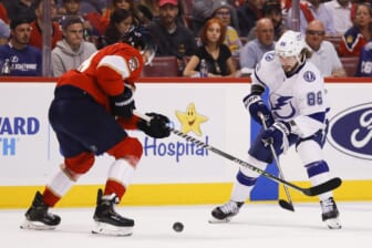 May 17, 2022; Sunrise, Florida, USA; Tampa Bay Lightning right wing Nikita Kucherov (86) and Florida Panthers defenseman Ben Chiarot (8) battle for the puck during the first period in game one of the second round of the 2022 Stanley Cup Playoffs at FLA Live Arena. Mandatory Credit: Sam Navarro-USA TODAY Sports