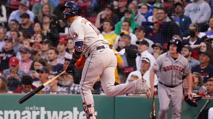 May 17, 2022; Boston, Massachusetts, USA; Houston Astros first baseman Yuli Gurriel (10) hits a two run home run against the Boston Red Sox in the second inning at Fenway Park. Mandatory Credit: David Butler II-USA TODAY Sports
