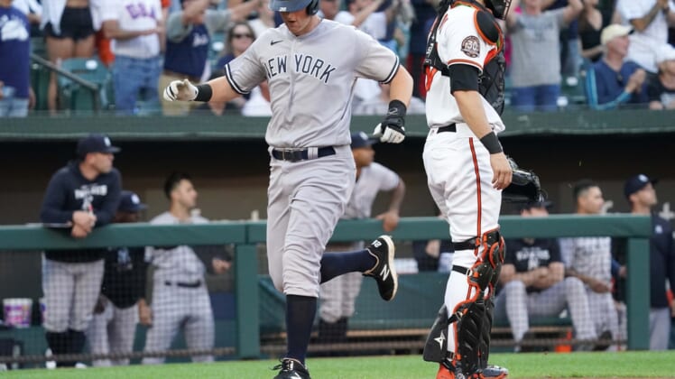 May 17, 2022; Baltimore, Maryland, USA; New York Yankees third baseman DJ LeMahieu (26) scores in the first inning on a double by Aaron Judge (not shown) against the Baltimore Orioles at Oriole Park at Camden Yards. Mandatory Credit: Mitch Stringer-USA TODAY Sports