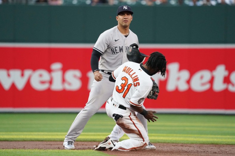 May 17, 2022; Baltimore, Maryland, USA; Baltimore Orioles outfielder Cedric Mullins (31) is forced out in the first inning by New York Yankees second baseman Gleyber Torres (25) at Oriole Park at Camden Yards. Mandatory Credit: Mitch Stringer-USA TODAY Sports