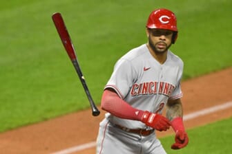 May 17, 2022; Cleveland, Ohio, USA; Cincinnati Reds left fielder Tommy Pham (28) tosses his bat after walking in the tenth inning against the Cleveland Guardians at Progressive Field. Mandatory Credit: David Richard-USA TODAY Sports