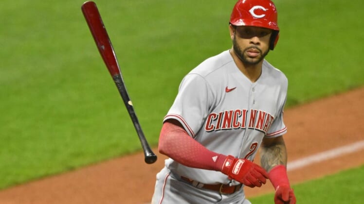 May 17, 2022; Cleveland, Ohio, USA; Cincinnati Reds left fielder Tommy Pham (28) tosses his bat after walking in the tenth inning against the Cleveland Guardians at Progressive Field. Mandatory Credit: David Richard-USA TODAY Sports