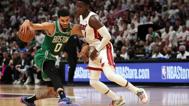 May 17, 2022; Miami, Florida, USA; Boston Celtics forward Jayson Tatum (0) dribbles around Miami Heat guard Tyler Herro (14) during the first half of game one of the 2022 eastern conference finals at FTX Arena. Mandatory Credit: Jasen Vinlove-USA TODAY Sports