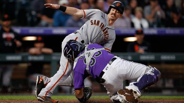 May 17, 2022; Denver, Colorado, USA; San Francisco Giants center fielder Mike Yastrzemski (5) slides safely into home ahead of the tag from Colorado Rockies catcher Elias Diaz (35) in the fourth inning at Coors Field. Mandatory Credit: Isaiah J. Downing-USA TODAY Sports