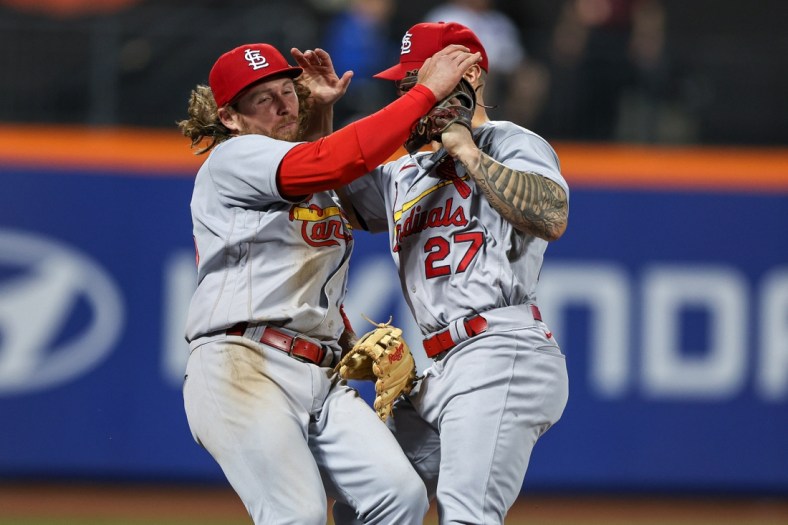 May 17, 2022; New York City, New York, USA; St. Louis Cardinals third baseman Brendan Donovan (33) collides with left fielder Tyler O'Neill (27) after failing to catch a foul ball during the eighth inning against the New York Mets at Citi Field. Mandatory Credit: Vincent Carchietta-USA TODAY Sports