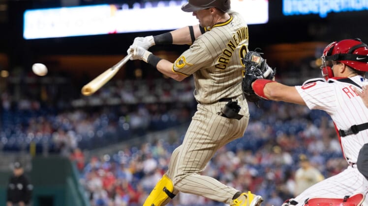 May 17, 2022; Philadelphia, Pennsylvania, USA; San Diego Padres second baseman Jake Cronenworth (9) hits a single during the sixth inning against the Philadelphia Phillies at Citizens Bank Park. Mandatory Credit: Bill Streicher-USA TODAY Sports