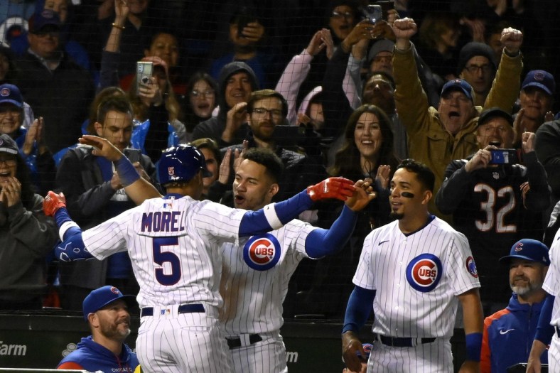 May 17, 2022; Chicago, Illinois, USA;  Chicago Cubs Christopher Morel (5) greets catcher Willson Contreras (40) after hitting a solo home run against the Pittsburgh Pirates during the eighth inning at Wrigley Field. It was his first home run at his first at bat in the major leagues.  Mandatory Credit: Matt Marton-USA TODAY Sports