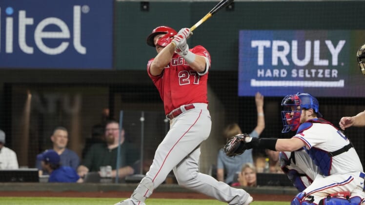 May 17, 2022; Arlington, Texas, USA; Los Angeles Angels center fielder Mike Trout (27) follows through on his home run against the Texas Rangers during the seventh inning of a baseball game at Globe Life Field. Mandatory Credit: Jim Cowsert-USA TODAY Sports