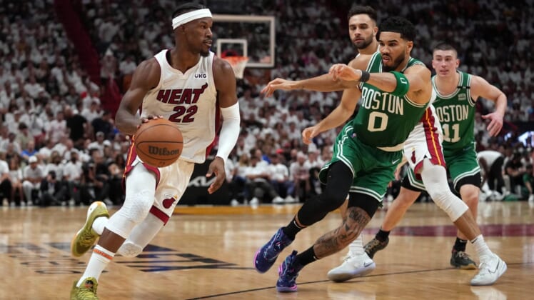 May 17, 2022; Miami, Florida, USA; Miami Heat forward Jimmy Butler (22) moves the ball up court against Boston Celtics forward Jayson Tatum (0) during the second half of game one of the 2022 eastern conference finals at FTX Arena. Mandatory Credit: Jasen Vinlove-USA TODAY Sports