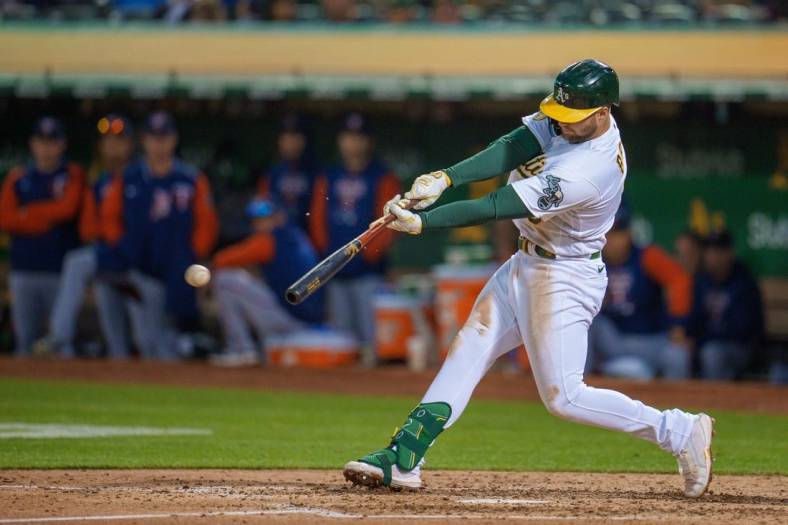 May 17, 2022; Oakland, California, USA; Oakland Athletics first baseman Seth Brown (15) hits a single during the fifth inning against the Minnesota Twins at RingCentral Coliseum. Mandatory Credit: Neville E. Guard-USA TODAY Sports
