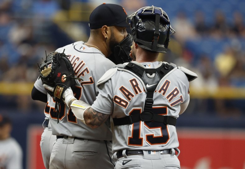 May 18, 2022; St. Petersburg, Florida, USA;  Detroit Tigers starting pitcher Eduardo Rodriguez (57) talks with Detroit Tigers catcher Tucker Barnhart (15) during the first inning against the Tampa Bay Rays at Tropicana Field. Mandatory Credit: Kim Klement-USA TODAY Sports
