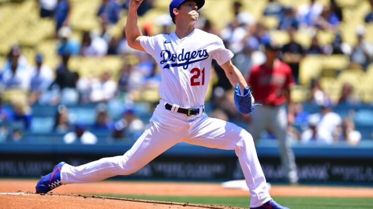 May 18, 2022; Los Angeles, California, USA; Los Angeles Dodgers starting pitcher Walker Buehler (21) throws against the Arizona Diamondbacks during the first inning at Dodger Stadium. Mandatory Credit: Gary A. Vasquez-USA TODAY Sports