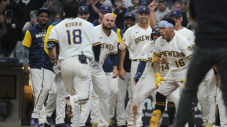 May 18, 2022; Milwaukee, Wisconsin, USA;  The Milwaukee Brewers celebrate an extra innings win on a home run by Milwaukee Brewers first baseman Keston Hiura (18) against the Atlanta Braves at American Family Field. Mandatory Credit: Michael McLoone-USA TODAY Sports