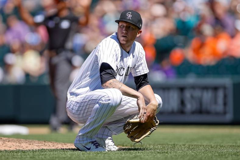 May 18, 2022; Denver, Colorado, USA; Colorado Rockies starting pitcher Kyle Freeland (21) looks on after a field attendant interfered with a live ball in the sixth inning against the San Francisco Giants at Coors Field. Mandatory Credit: Isaiah J. Downing-USA TODAY Sports