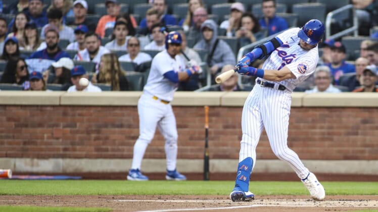 May 18, 2022; New York City, New York, USA;  New York Mets second baseman Jeff McNeil (1) hits a two run single in the first inning against the St. Louis Cardinals at Citi Field. Mandatory Credit: Wendell Cruz-USA TODAY Sports