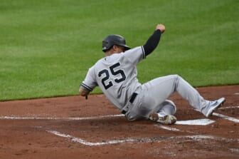 May 18, 2022; Baltimore, Maryland, USA; New York Yankees second baseman Gleyber Torres (25) slides a scores on a first inning wild pitch against the Baltimore Orioles  at Oriole Park at Camden Yards. Mandatory Credit: Tommy Gilligan-USA TODAY Sports