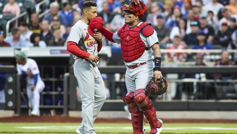 May 18, 2022; New York City, New York, USA; St. Louis Cardinals pitcher Jordan Hicks (12) catcher Yadier Molina (4) in the first inning against the New York Mets at Citi Field. Mandatory Credit: Wendell Cruz-USA TODAY Sports