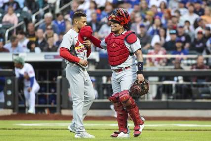 May 18, 2022; New York City, New York, USA; St. Louis Cardinals pitcher Jordan Hicks (12) catcher Yadier Molina (4) in the first inning against the New York Mets at Citi Field. Mandatory Credit: Wendell Cruz-USA TODAY Sports