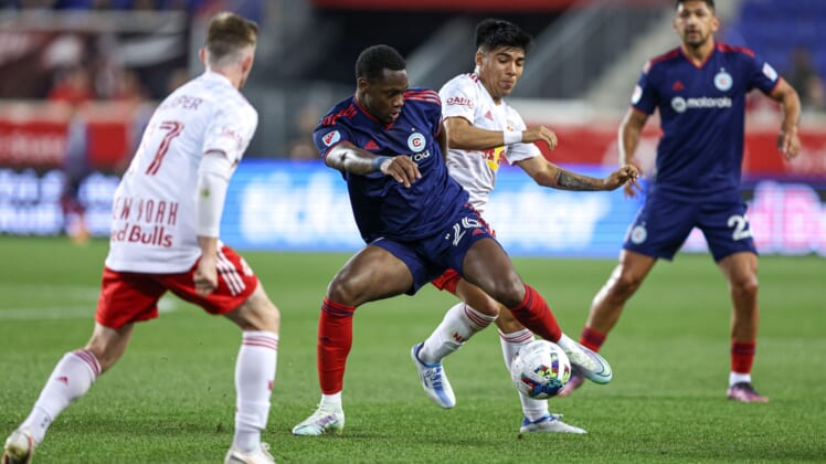 May 18, 2022; Harrison, New Jersey, USA; Chicago Fire forward Jhon Duran (26) plays the ball in front of New York Red Bulls midfielder Omir Fernandez (21) during the first half at Red Bull Arena. Mandatory Credit: Vincent Carchietta-USA TODAY Sports