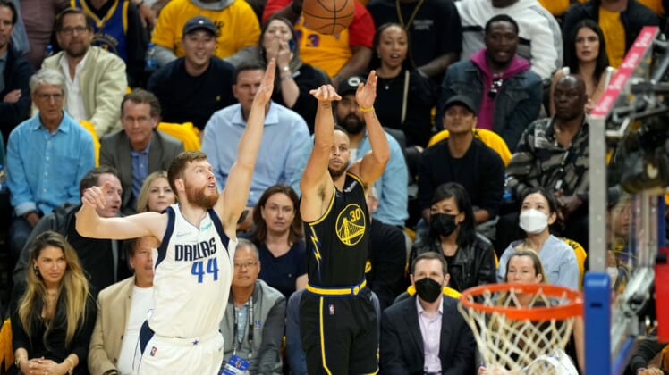May 18, 2022; San Francisco, California, USA; Golden State Warriors guard Stephen Curry (30) shoots against Dallas Mavericks forward Davis Bertans (44) during the first quarter of game one of the 2022 western conference finals at Chase Center. Mandatory Credit: Darren Yamashita-USA TODAY Sports