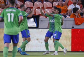 May 18, 2022; Houston, Texas, USA; Seattle Sounders FC forward Raul Ruidiaz (9) celebrates with teammates after scoring a goal during the first half against the Houston Dynamo FC at PNC Stadium. Mandatory Credit: Troy Taormina-USA TODAY Sports