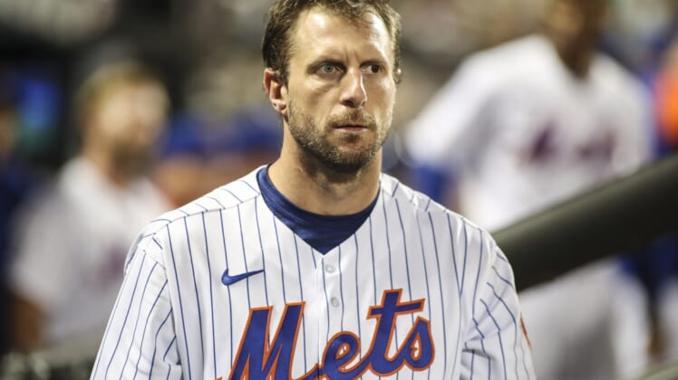 May 18, 2022; New York City, New York, USA; New York Mets starting pitcher Max Scherzer (21) looks out from the dugout in the fifth inning against the St. Louis Cardinals at Citi Field. Mandatory Credit: Wendell Cruz-USA TODAY Sports