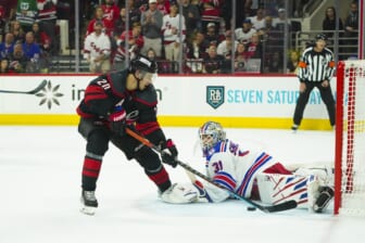May 18, 2022; Raleigh, North Carolina, USA; Carolina Hurricanes center Sebastian Aho (20) scores a goal past New York Rangers goaltender Igor Shesterkin (31) during the third period in game one of the second round of the 2022 Stanley Cup Playoffs at PNC Arena. Mandatory Credit: James Guillory-USA TODAY Sports