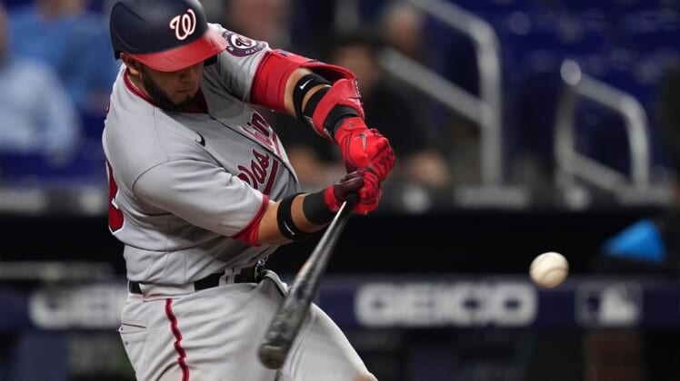 May 18, 2022; Miami, Florida, USA; Washington Nationals catcher Keibert Ruiz (20) singles in the go ahead and eventual game winning run in the tenth inning against the Miami Marlins at loanDepot park. Mandatory Credit: Jasen Vinlove-USA TODAY Sports